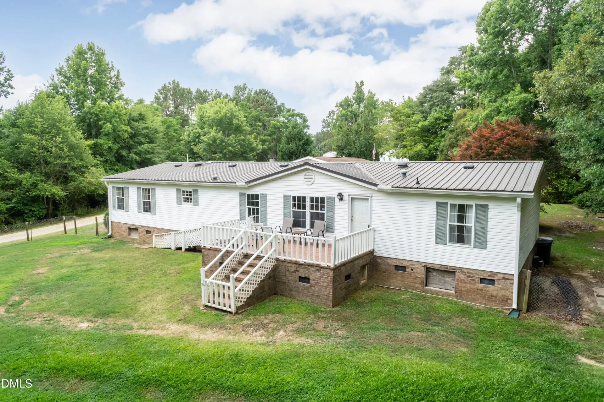 A welcoming residential home surrounded by mature trees